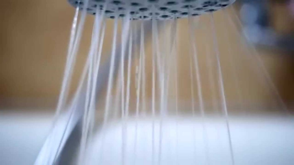 Still from from CC licensed YouTube video "Water sprays out of a shower head in slow motion"